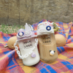 Plastic cartoon style coffee cup with straw